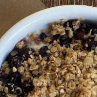 Yogurt & Granola · Homemade granola, blueberries and yogurt. Contain nuts.