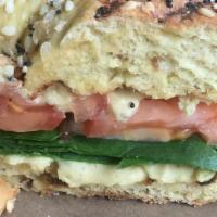 Bagel With Hummus, Tomato And Spinach · In house made hummus with tomato and baby spinach on your choice of bagel.