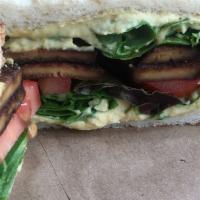 L.T · In housemade tofu bacon, tomato, mixed greens, and hummus.