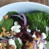 Spinach Salad · Onions, toasted walnuts, dried cranberries, feta cheese on baby spinach.