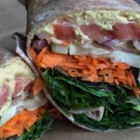 Hummus Wrap · In house made hummus, tomato, cucumber, onion, carrots, and mixed greens.