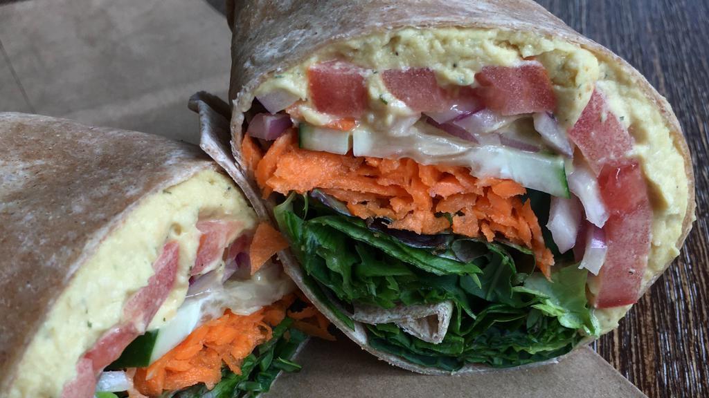 Hummus Wrap · In house made hummus, tomato, cucumber, onion, carrots, and mixed greens.