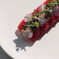 Yellowfin Tuna Crudo* · Sliced sashimi quality tuna with umami-rich tare, ginger-scallion sauce, radishes and house ...