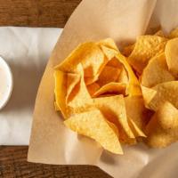 Chips & Queso · Bag of chips and 8oz of white queso.