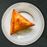 Sambusa · Crispy pastry triangle shaped filled with minced lentils, onion, garlic, jalapeño, pepper, a...