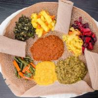 Veggie Combo (6 Items) · Vegetarian, spicy. Lentils, yellow peas, mild lentils, collard greens, shiro cabbage, and to...