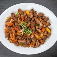 Warka Tibs · Tender beef with onion, jalapeño, with a touch of fresh garlic, and tomato (well done, mediu...