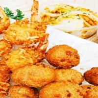 Coconut Shrimp (9 Pcs.) · Crispy fried coconut shrimp with your choice of two side dishes and choice of corn bread or ...