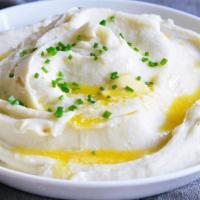 Mashed Potatoes With Gravy · Creamy mashed potatoes with gravy.