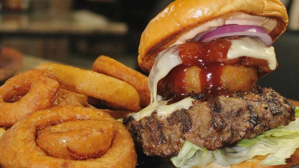 Texas Cheeseburger · 1/2 pound house made grilled patty , melted  pepper jack cheese,  onion rings, BBQ sauce, with house dressing