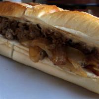 Wiz Wit Cheesesteak · House-made cooper sharp wiz and fried onion. Served with choice of side.