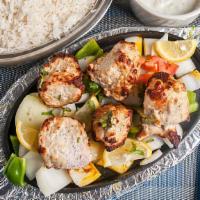 Malai Kebab · Tender pieces of chicken breast marinated in special cream sauce and grilled in the tandoor ...