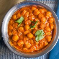 Chana Masala · Chick peas and fresh tomatoes cooked in traditional spices.