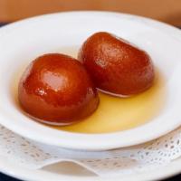 Galub Jamun · Fried cheese ball dipped in honey syrup.