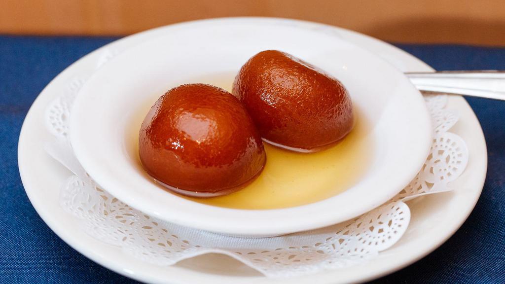 Galub Jamun · Fried cheese ball dipped in honey syrup.