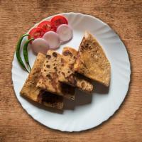 Potato Paratha · Whole wheat flat bread filled with mildly spiced potatoes and pan fried golden