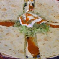 Quesadillas · Chicken, pork, or beef. A 12 inch flour tortilla folded over and stuffed with meat of choice...