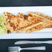 Quesadilla · A 12 inch flour tortilla folded over, stuffed with cheese, tomatoes, corn, peas, carrots, gr...