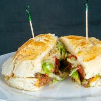 Tortas · Bulky roll sandwich with mayonnaise, rice, beans, corn, cheese, cilantro, onions, and red sa...