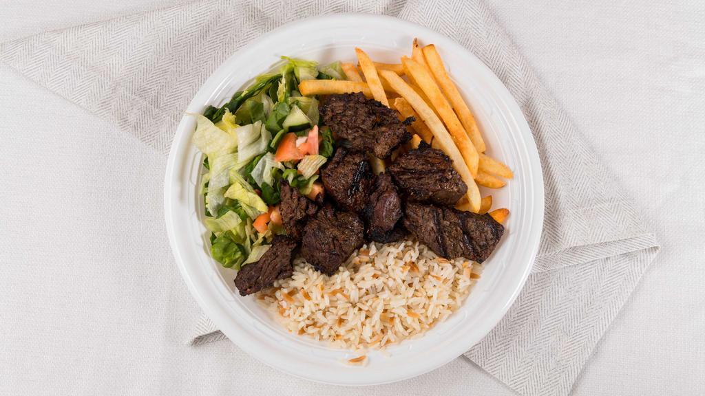 Steak Tips Dinner · Served with rice, French fries and salad.