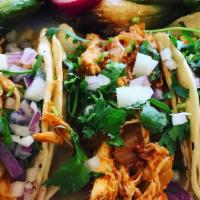 Tinga De Pollo Tacos (3) · Shredded Chipotle chicken. Choice of corn or flour tortillas topped with cilantro, onions, s...