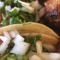 Carnitas Tacos (3) · Slow-cooked pork. Choice of corn or flour tortillas topped with cilantro, onions, scallions,...