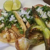 Fish Tacos (3) · Grilled tilapia fish. Choice of corn or flour tortillas topped with cilantro, onions, scalli...
