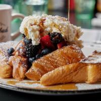 Classic French Toast · thick cut brioche, orange + vanilla + cinnamon dipped, mixed berries, vermont maple syrup, m...