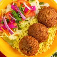 Falafel Hummus Plate · Plate of rice and salad with three falafel pieces, hummus, tahini sauce, and wrapro's house ...