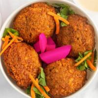 Falafel Side · Four golden chick-pea balls serve with tahini sauce on the side.
