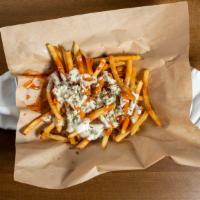 Buffalo Fries · Topped with buffalo sauce, blue cheese sauce, blue cheese crumbles and scallions.