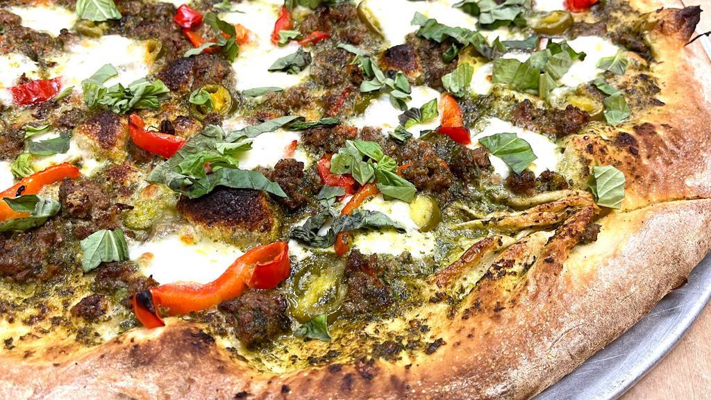Spicy Meatball Pesto  Margherita Pizza. ( New ) · white pizza with pesto sauce topped with roasted garlic, roasted red pepper, jalapeno pepper, fresh mozzarella and fresh basil.