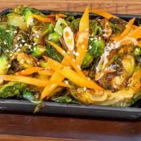 Brussels Sprouts · Sweet chili sauce, scallions, carrots, and sesame seeds.
