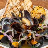 Chardonnay Mussels · Steamed with white wine shallots, parsley, butter, lemon, side of rustic bread.