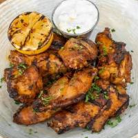 Chicken Wings · 1 lb spiced wings with your choice of sauce