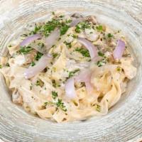 Porcini Mushrooms Pasta · Homemade Fettuccini noodles, truffle oil, exotic porcini mushroom cream sauce.