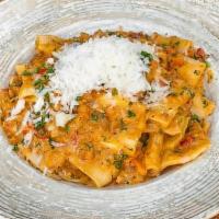Bolognese A La Vodka · Homemade Rigatoni pasta creamy beef ragout, bell peppers, carrots and parsley.