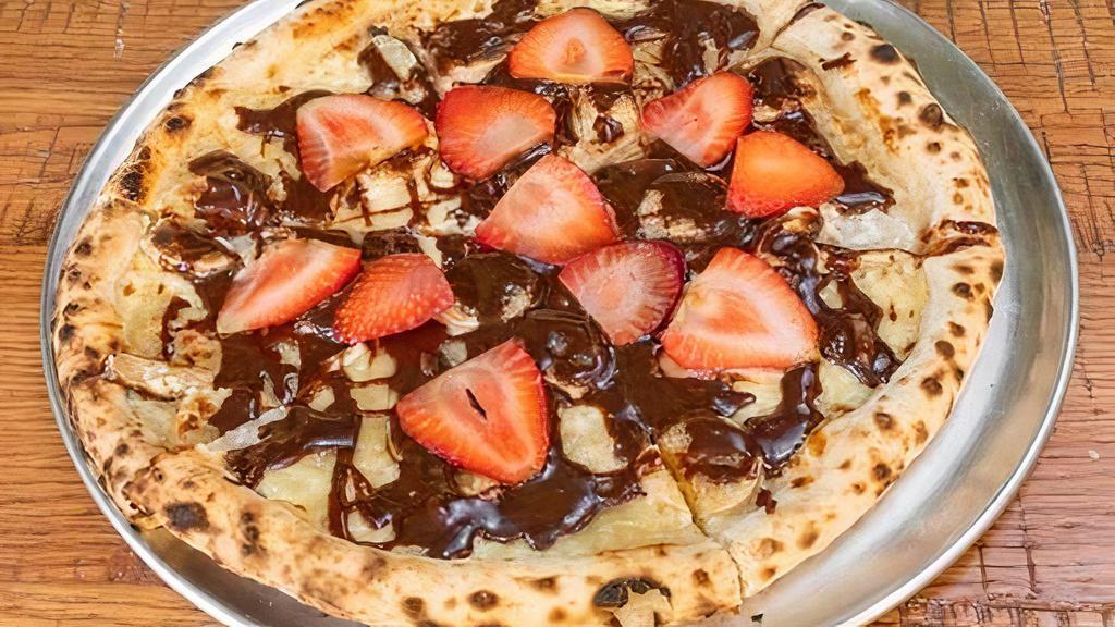 Nutella Pizza · 12'' pie, topped with sweet mascarpone cream, Nutella, and fresh strawberries.