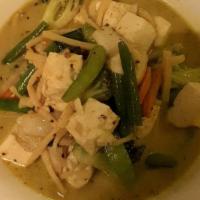 Green Curry · Hot and spicy. Thai green curry with coconut milk, bamboo shoots, carrots, Thai basil leaves...