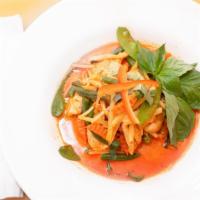 Red Curry · Hot and spicy. Thai red curry with coconut milk, bamboo shoots, carrots, Thai basil leaves a...