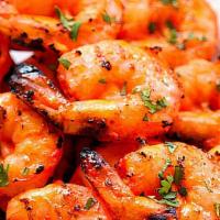 Tandoori Shrimp (Our Signature Dish) · Marinated Shrimp is grilled over red-hot coals. The pieces are brushed with ghee (clarified ...