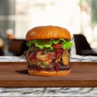 Bbq Burger · American beef patty topped with melted cheese, barbecue sauce, and caramelized onions. Serve...