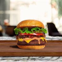 Classic Burger · American beef patty topped with lettuce, tomato, onion, and pickles. Served on a fresh Kaise...
