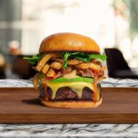 French Fries Burger · American beef patty topped with fries, avocado, caramelized onions, ketchup, lettuce, tomato...