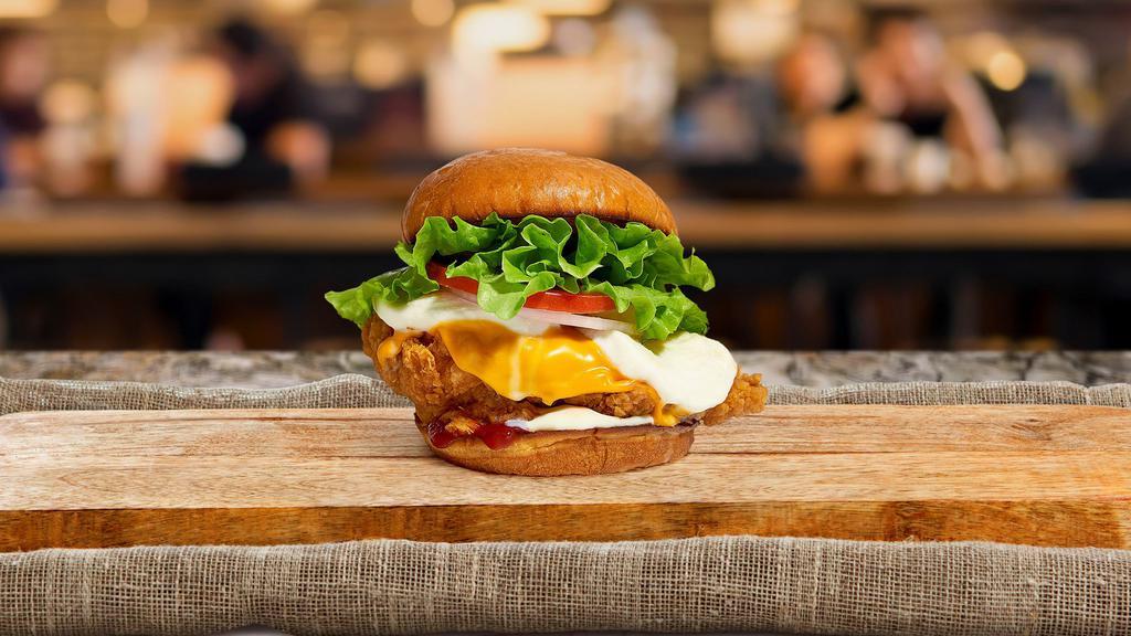 Monster Cheese Fried Chicken Sandwich · Buttermilk fried chicken, cheddar, mozzarella, lettuce, tomato, red onion, mayo, and ketchup served on a fresh Kaiser roll.