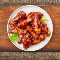 Bbq Chicken Wings · Fresh chicken wings breaded, fried until golden brown, and tossed in barbecue sauce. Served ...
