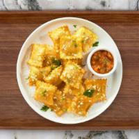 Fried Ravioli · (Vegetarian) Cheese-filled ravioli breaded and fried until golden brown. Served with housema...