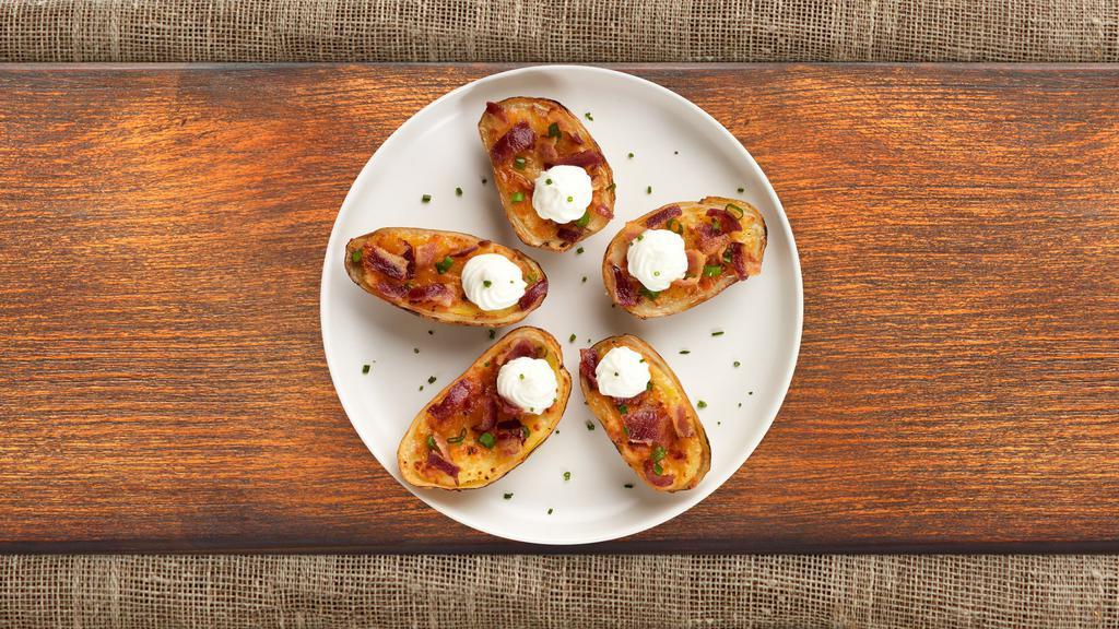 Plain Potato Skins · Baked potato skins filled with cheddar cheese, bacon, scallions, and topped with sour cream.