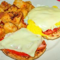 #7. Jd'S Muffin · fried egg served on a grilled English muffin with sliced tomatoes, ham, melted cheese and ho...