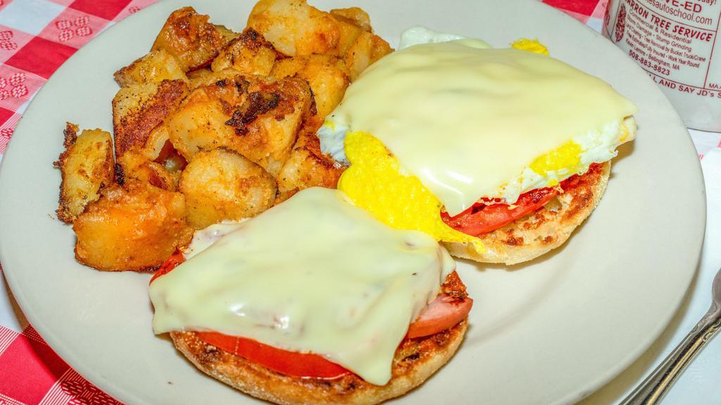 #7. Jd'S Muffin · fried egg served on a grilled English muffin with sliced tomatoes, ham, melted cheese and home fries.